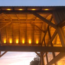 Outdoor open gable structure with low voltage accent lights 