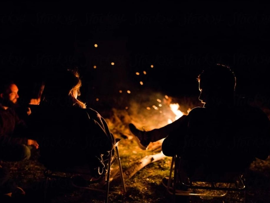People sitting around a fire.
