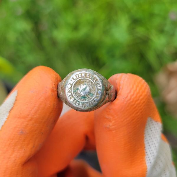 An Albion College class ring identified during archaeological investigation in Detroit, Michigan.