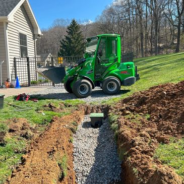 Installing a water drainage line in the backyard