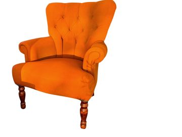 Vibrant orange velvet wingback armchair for luxury wedding lounge hire and event styling Scotland
