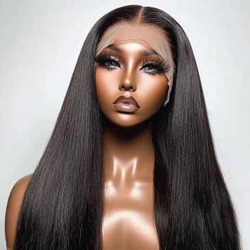 A mannequin with long, sleek black hair and glossy makeup.