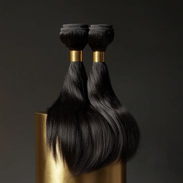 Two bundles of sleek, black hair extensions with gold bands.