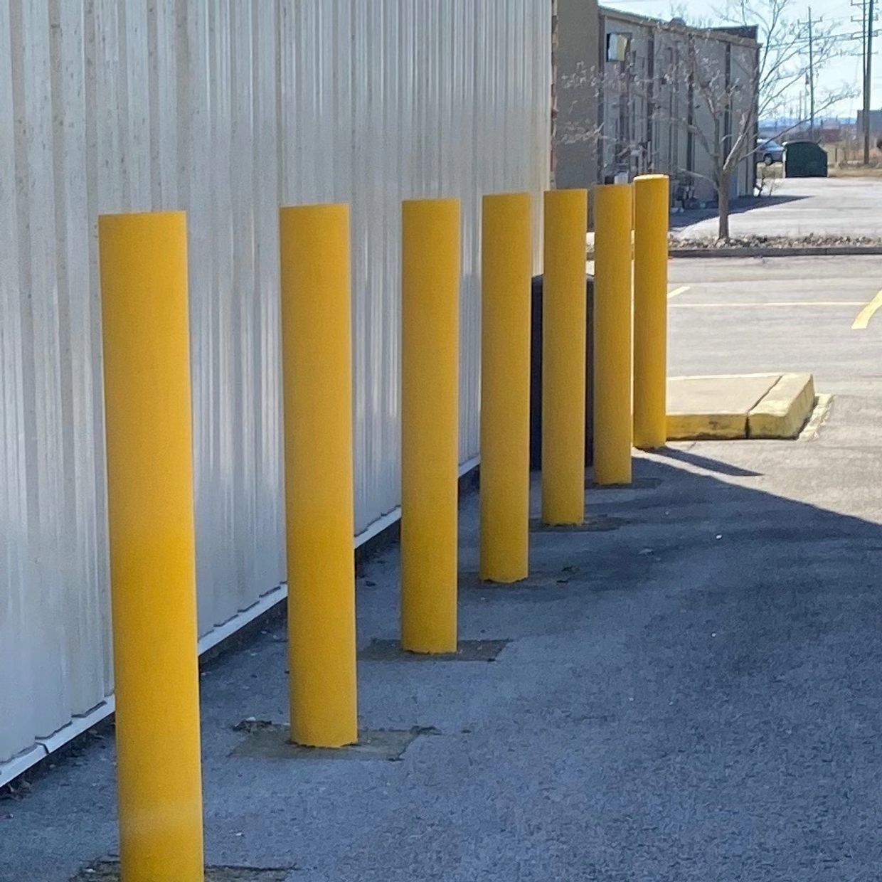 Parking Lot Bollards installed by A&S Sealcoating in Southern Indiana and Louisville. 