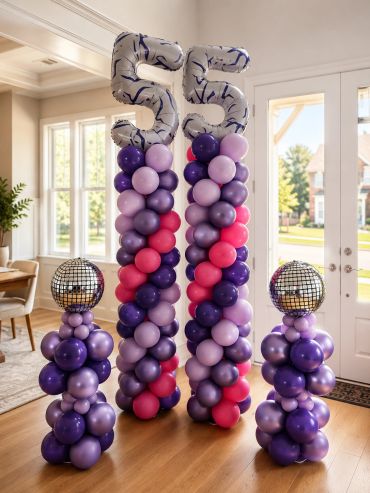 Colorful balloon decoration with number 55 in silver balloons.