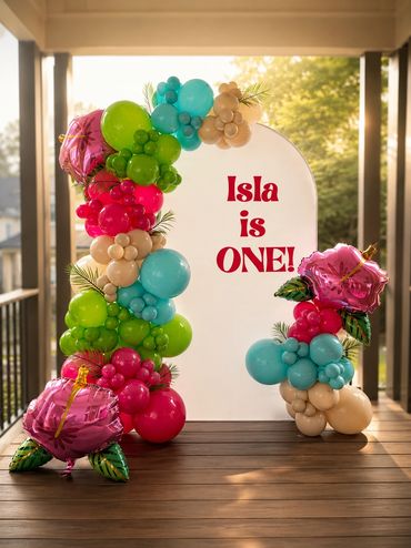 Colorful balloon arch for Isla's first birthday.