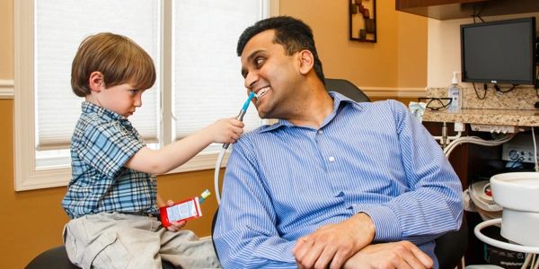 Little boy pretends to be a dentist