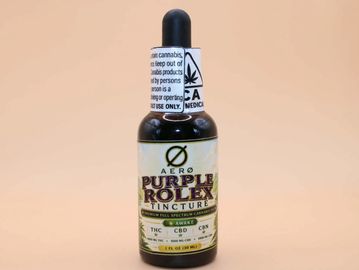 A bottle of Aero Purple Rolex tincture with THC, CBD, and CBN.