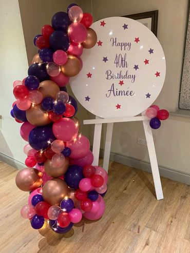 Easel hire with Balloon Garland in Abby colour scheme and any message 
