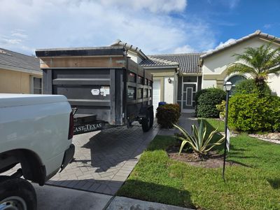 Dumpster parked on a Jupiter job site offering affordable dumpster rentals with same-day dumpster rental service for construction and cleanup projects