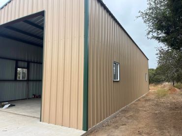 Metal building with open side and small windows