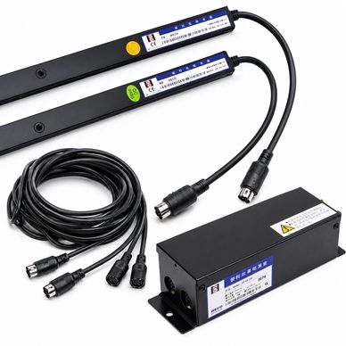 Set of black electronic components with cables, including sensors and a control box.
