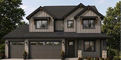 Modern two-story house with a gray exterior and front porch.