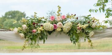 Wedding Arch decorated with fresh flowers 