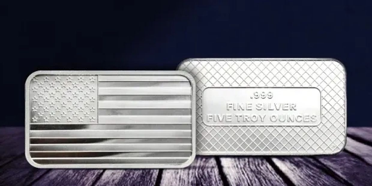 Two silver bars, one with the American flag, the other marked as five troy ounces of fine silver.