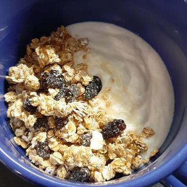 Kefir picture for breakfast with granola and honey