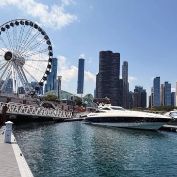 City waterfront with Ferris wheel and yacht.