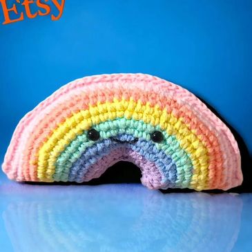 Smiling pastel crocheted rainbow