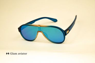 Blue aviator sunglasses with gold accents on a light background.