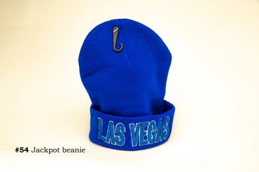 Bright blue Las Vegas jackpot beanie with a hook pin attached.