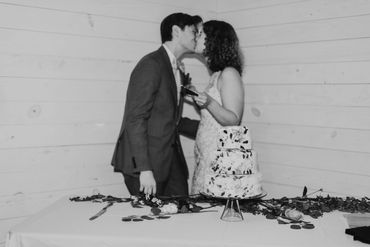 couple cutting a cake at wedding