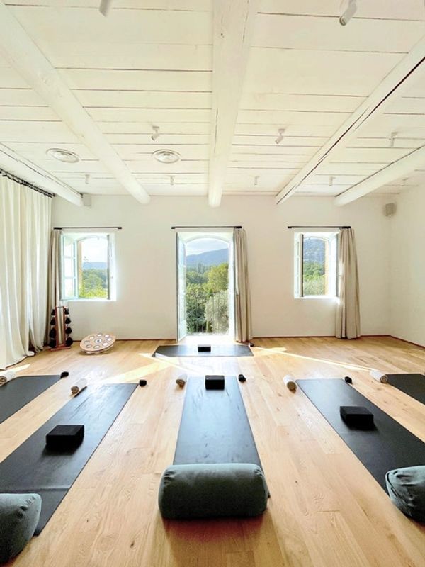 A yoga classroom with yoga mats