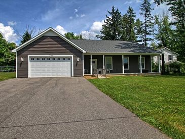 Single-story house with attached garage and front porch.