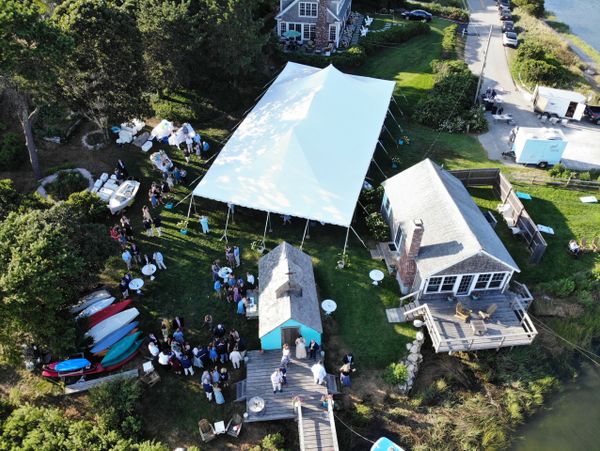 Aerial videography professionals setting up equipment in Cape Cod, MA.