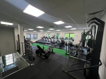 Spacious, well-lit gym with cardio and strength equipment.