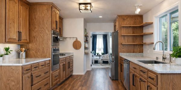 Spacious kitchen with wooden cabinets and modern appliances.