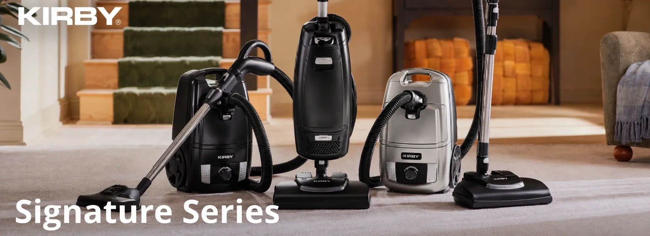 Kirby Signature Series vacuum cleaners displayed indoors.