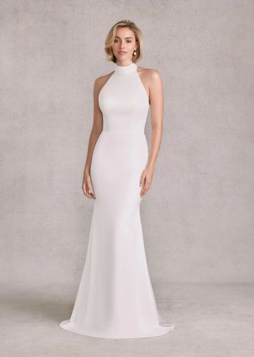 Woman wearing a sleek, white halter-neck evening gown.