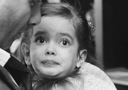 Rachaeli Fier, a 7-year-old with Tay-Sachs disease, with her father.