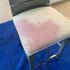 Red wine spill on white dining room chair before cleaning.