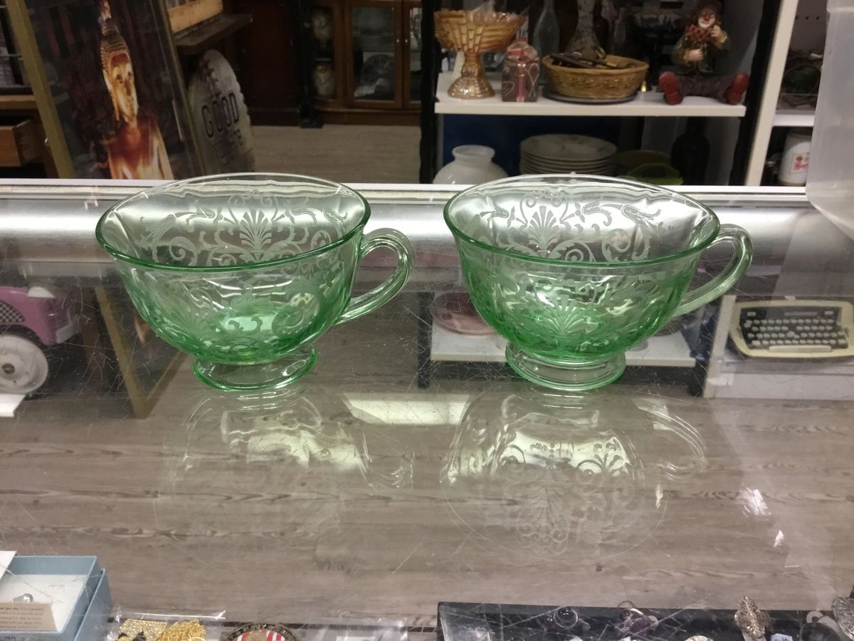 .Uranium glass tea cup etched with handle. 2 available