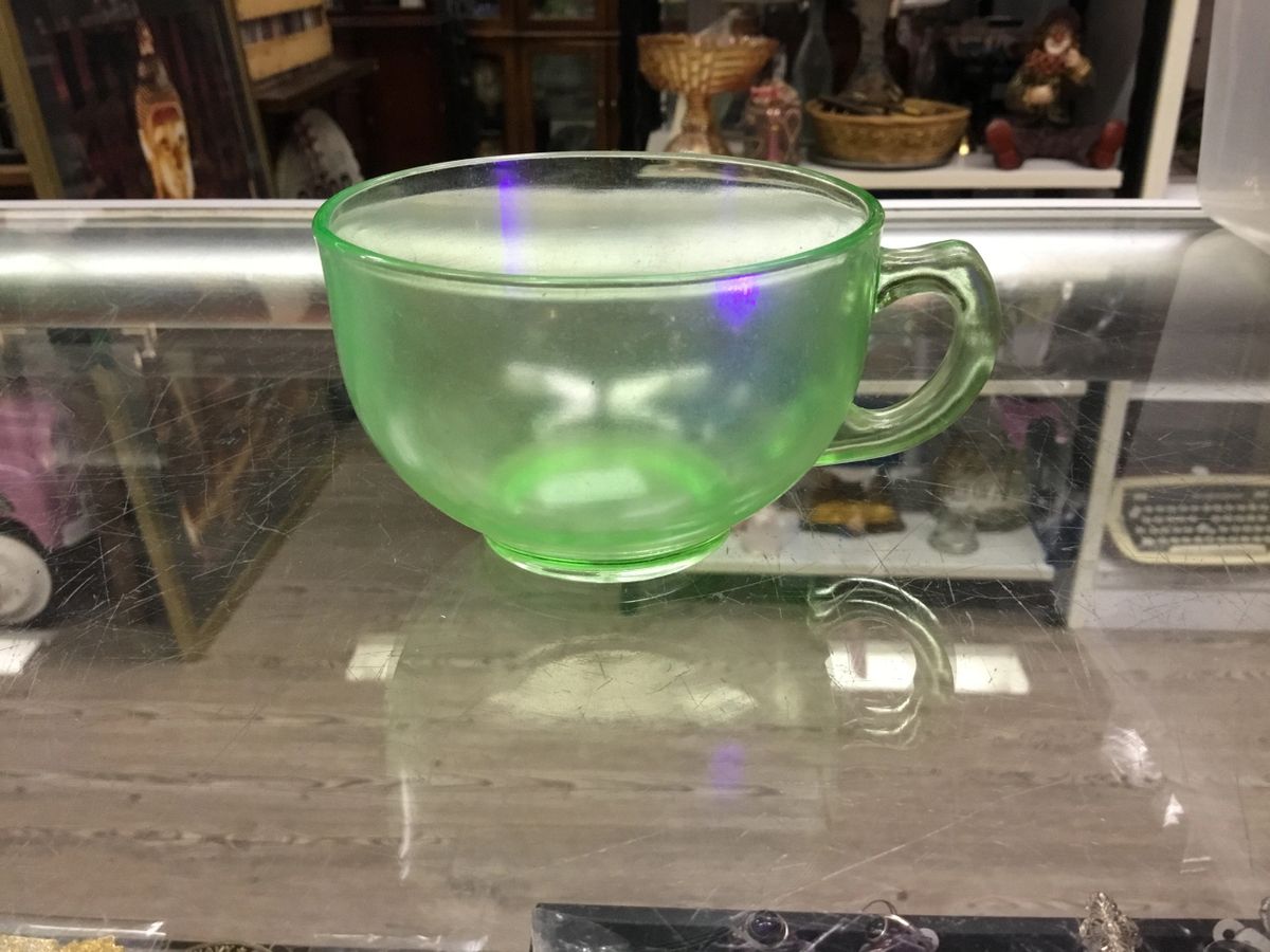 .Uranium glass tea cup with handle