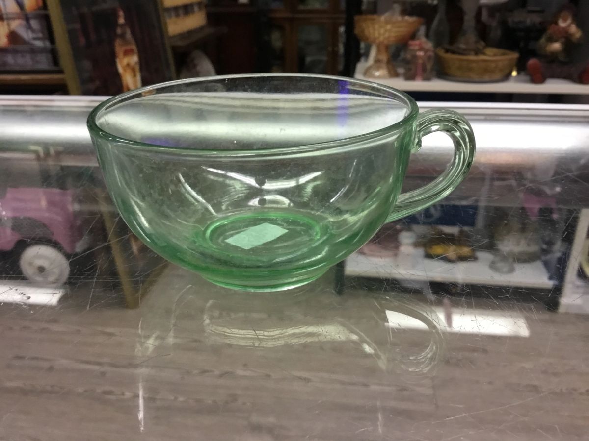 .Uranium glass tea cup with handles