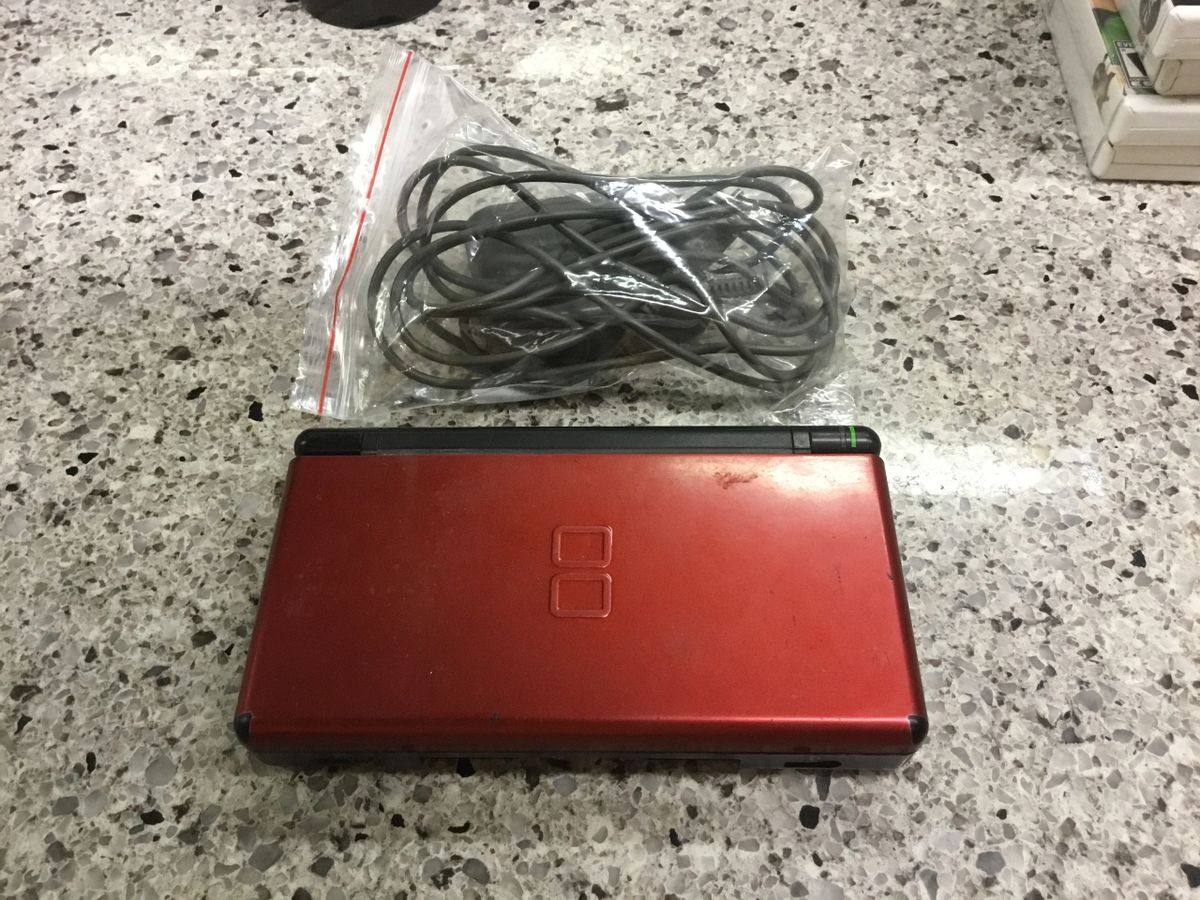 Red Nintendo DS Lite use001 with power cord. Tested, works.