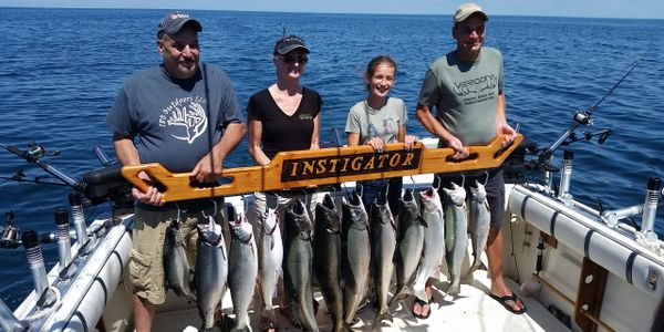 Family fun time while fishing for trout and salmon on Lake Ontario