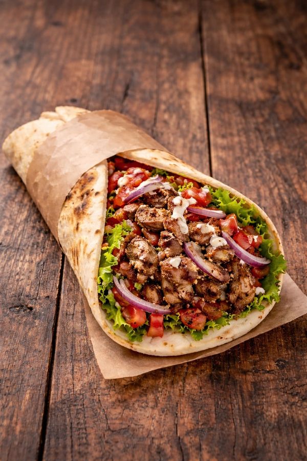 LAMB DONER WRAP
Tender, slow-cooked lamb doner, thinly sliced and served in a warm wrap with fresh s