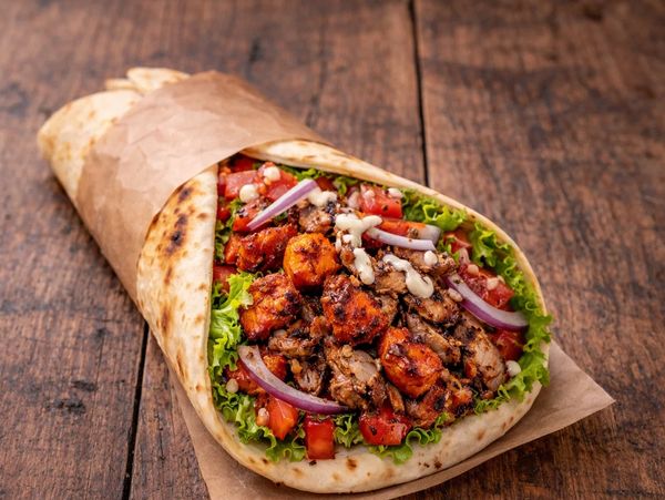 Chicken Shawarma
Tender grilled chicken tikka wrapped in soft naan with fresh salad and flavourful