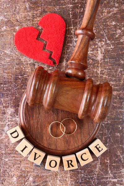 Gavel with broken red heart.