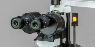 Close-up of a binocular microscope with 10x eyepieces.