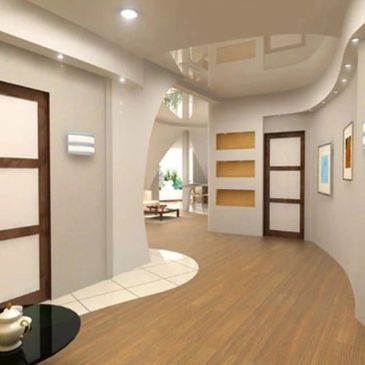 Modern hallway with curved walls and wooden flooring.