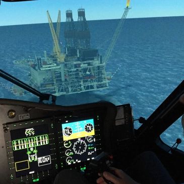 View from a helicopter cockpit approaching an offshore oil rig.