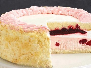 Pink and white layered cake with jam filling and pink frosting.