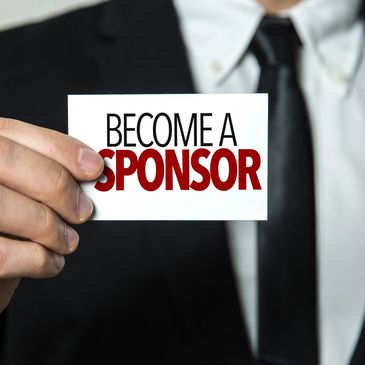 Person in suit holding card saying 'Become a Sponsor'.