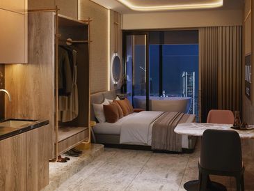 Modern studio apartment with cozy lighting and city view.