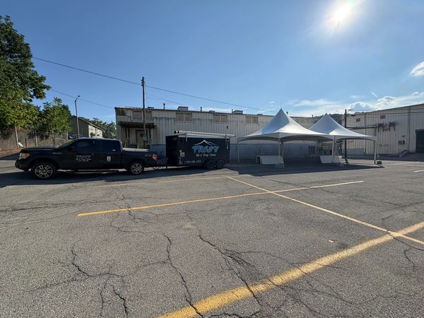 20x40 frame tent on asphalt for company picnic 