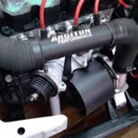 Close-up of a car engine with a visible air intake labeled "Allison Performance."